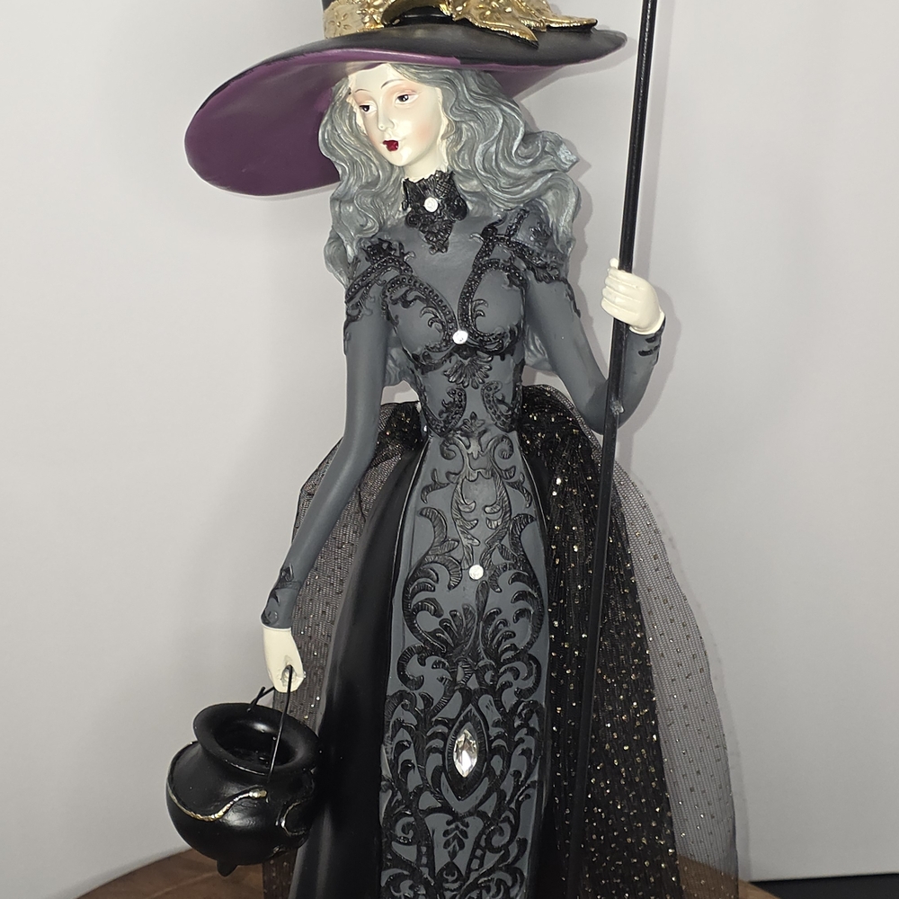 Elegant Witch Figurine with Purple Hat